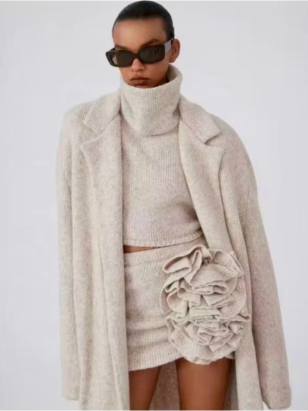 Loewe Cream Asymmetrical Knit Mini Skirt with Rosette Detail